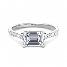 Costa east-to-west emerald cut engagement ring with tapered side stones in white gold