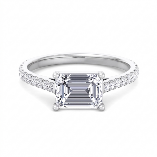 Costa east-to-west emerald cut engagement ring with tapered side stones in white gold