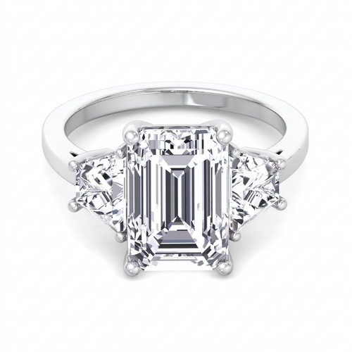 Vela three-stone engagement ring with emerald cut centre and trapezoid side stones